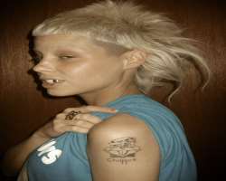 She loves tattoos and had many tattoos including the drawing of a Choppie on her biceps and 